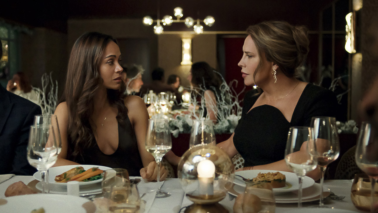 Zoe Saldana as Rita Moro Castro and Karla SofÃa Gascón as Emilia Pérez in Emilia Pérez.
